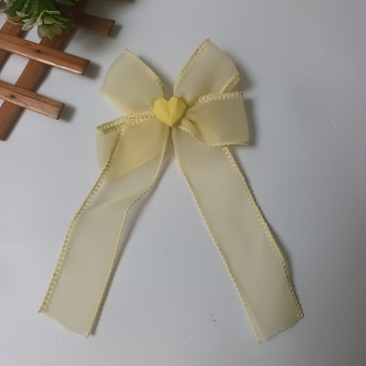 Alvina lemon yellow organza bow aligator pin