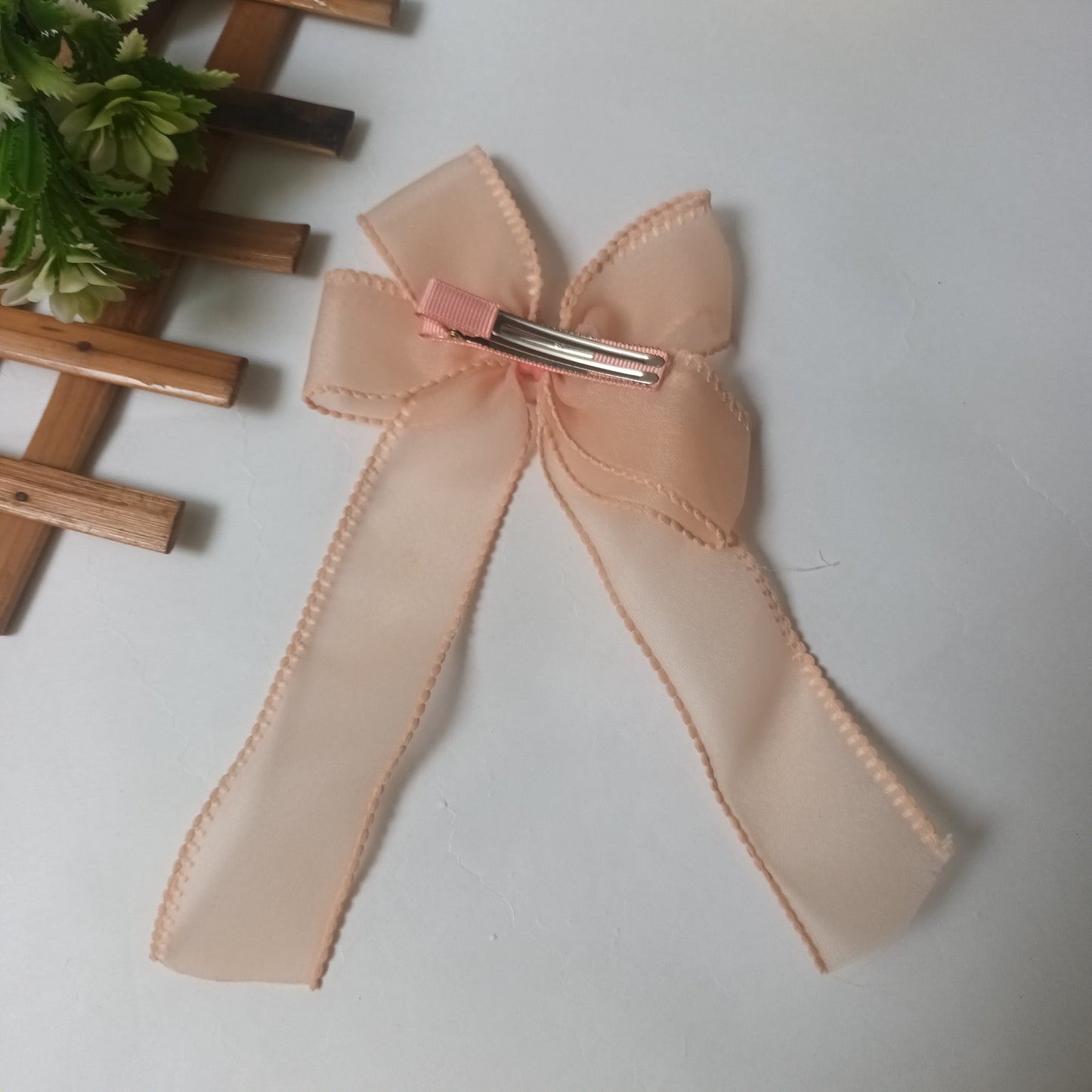 Alvina peach organza bow aligator pin