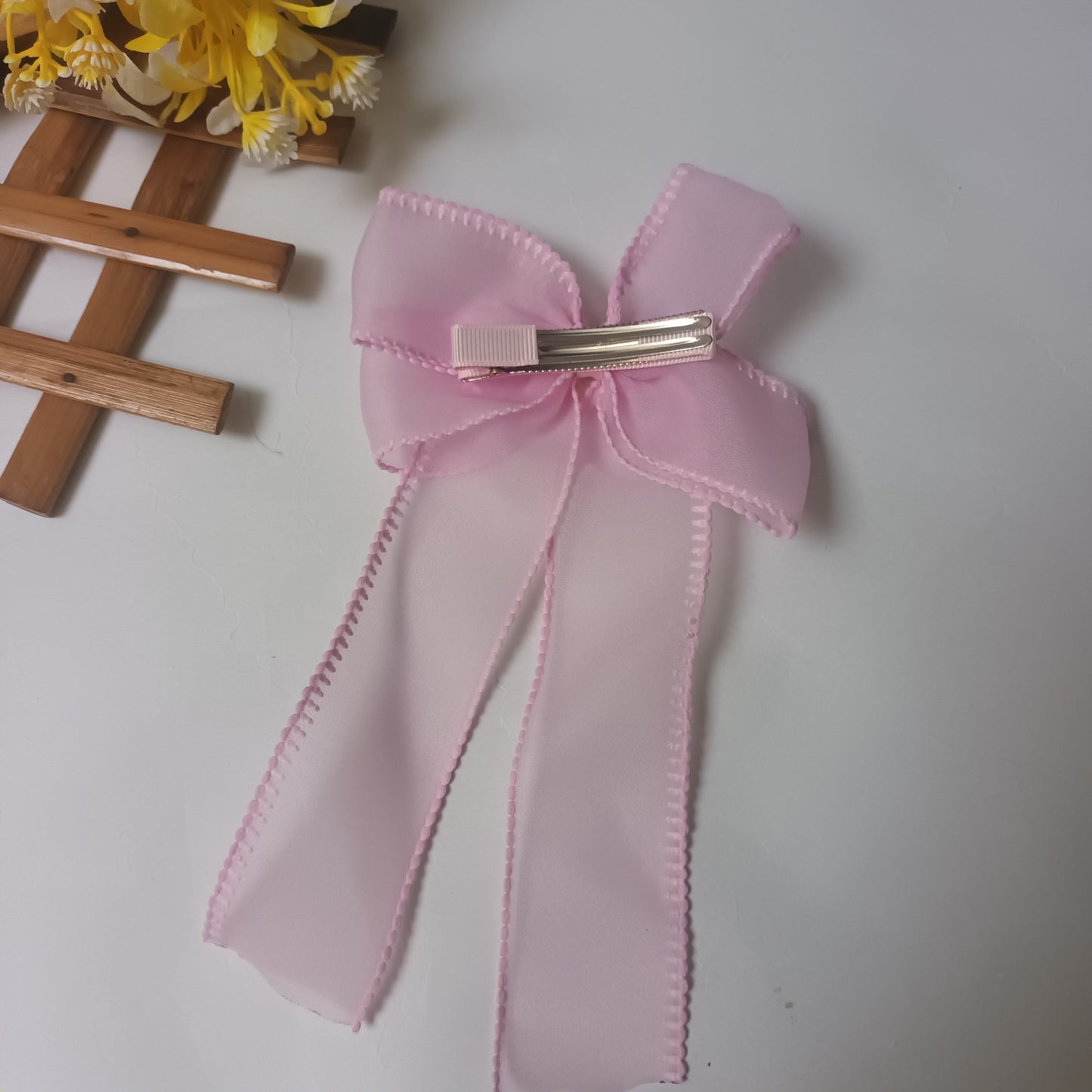 Alvina blush pink organza bow aligator pin