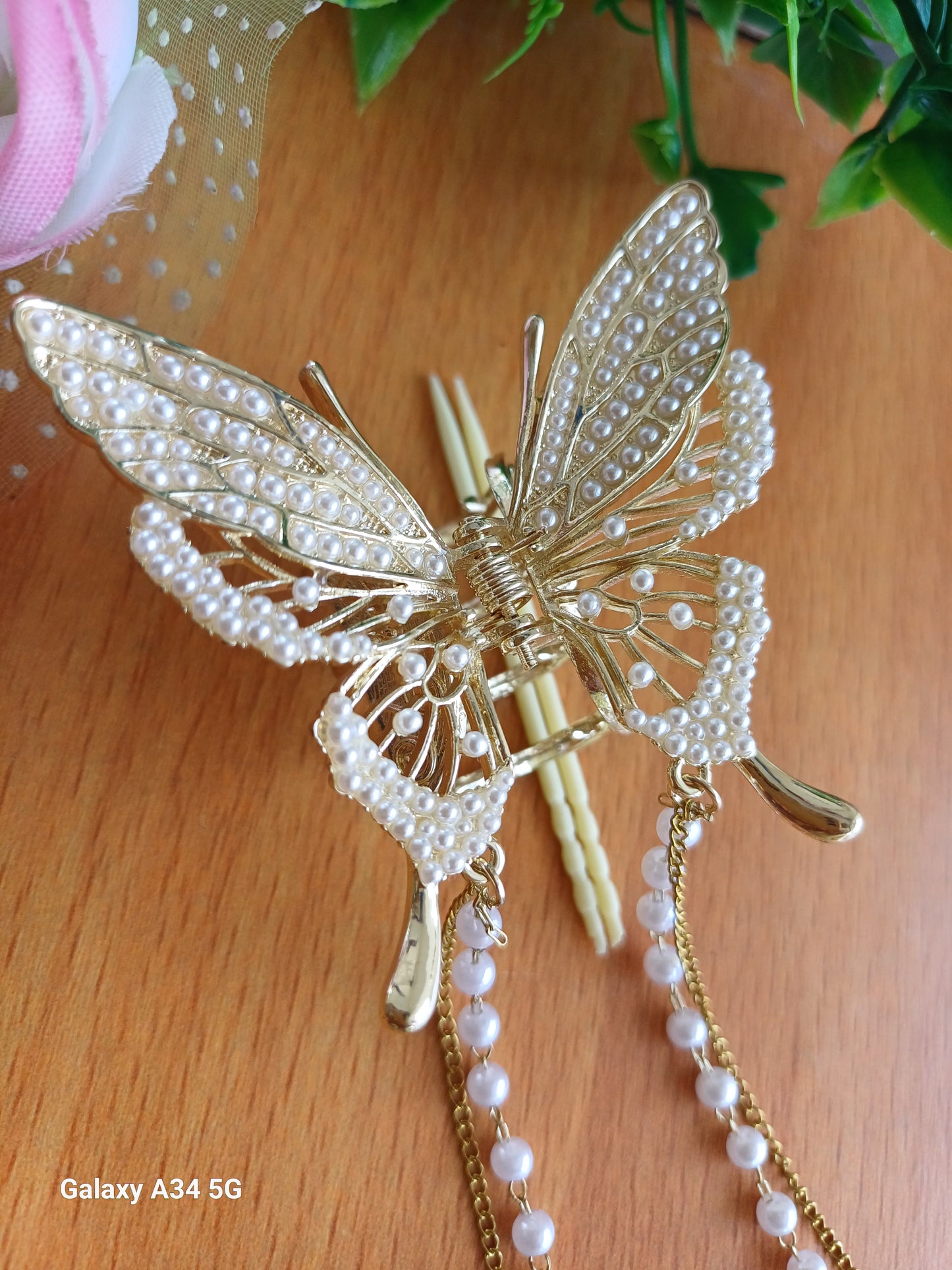 Shaila pearl butterfly tasseled claw